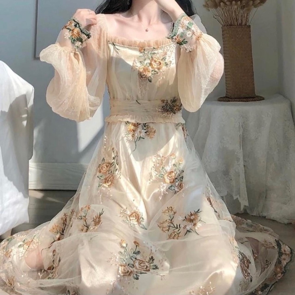 Classic, elegant, cream-colored “Paris dress”